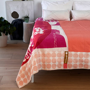 Fuschia quilt on bed